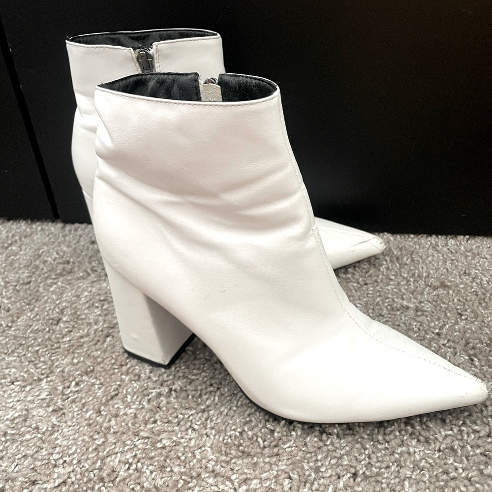 White pointed toe heeled booties